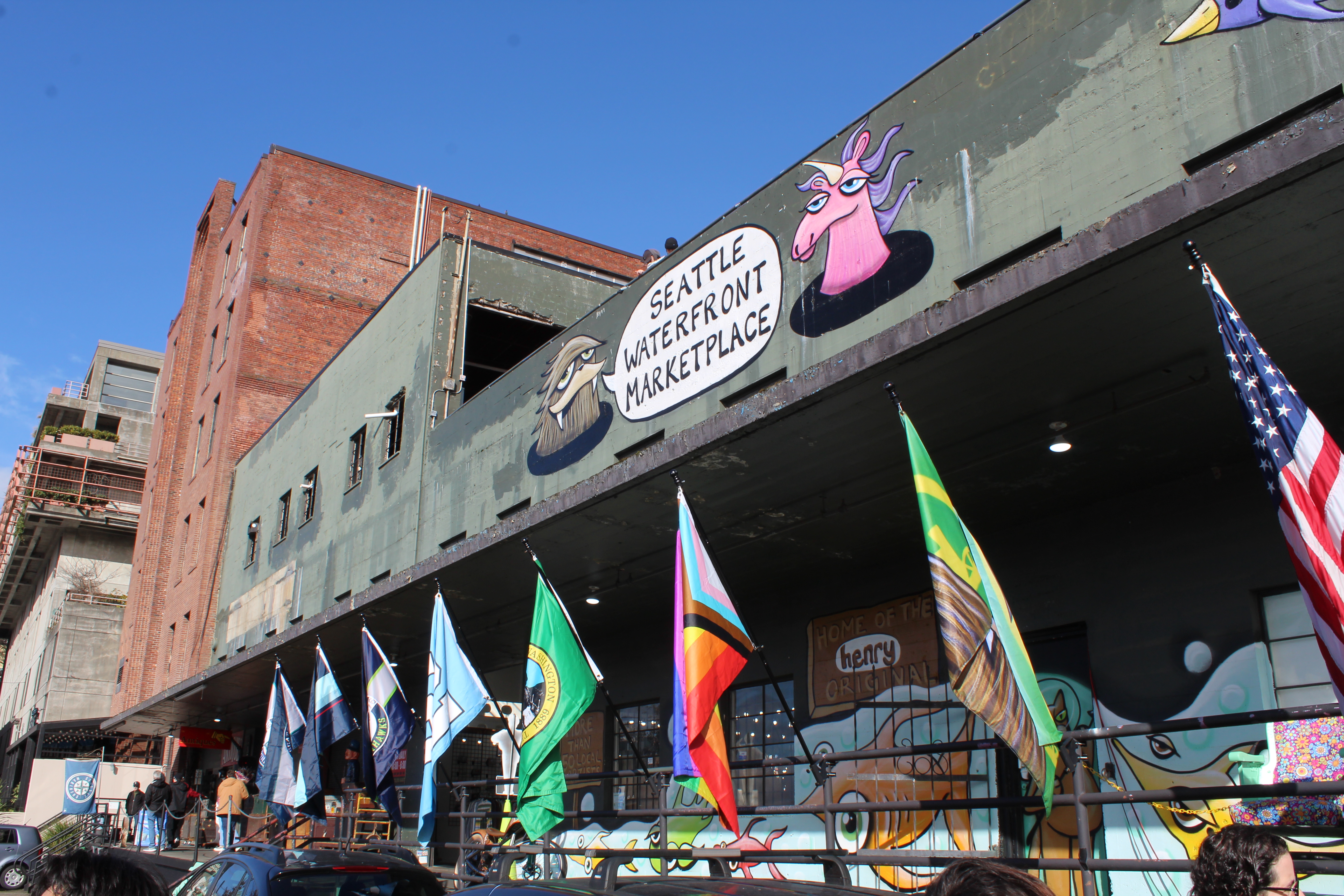 Collection of flags outside of the seattle waterfront marketplace